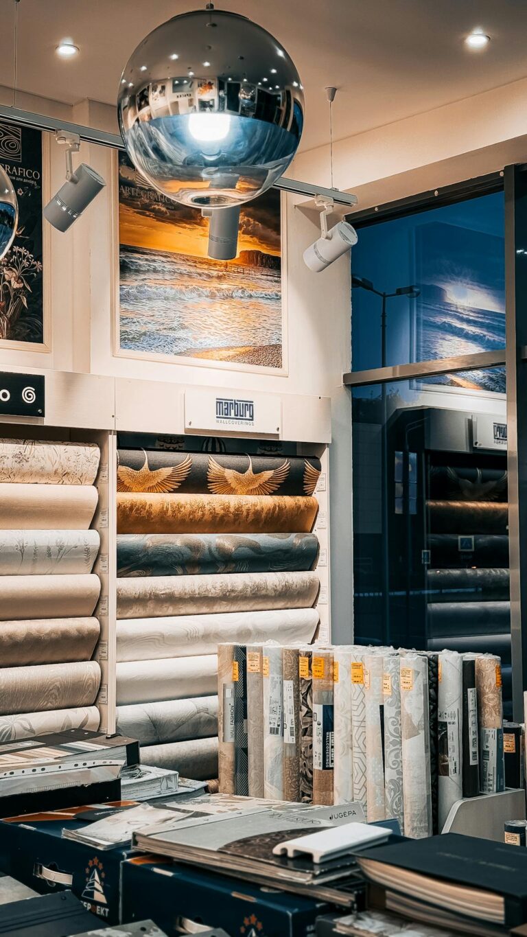 Modern showroom with diverse wallpaper designs and stylish lighting for elegant decor inspiration.
